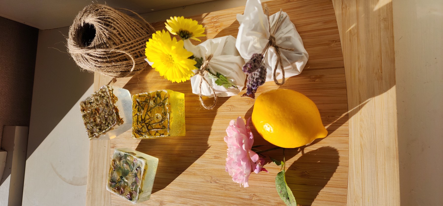 Natural ingredients and soap-making materials arranged on a worktop